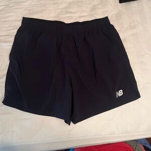 Navy blue 5” inseam running shorts. Inlining removed. Dryfit material.